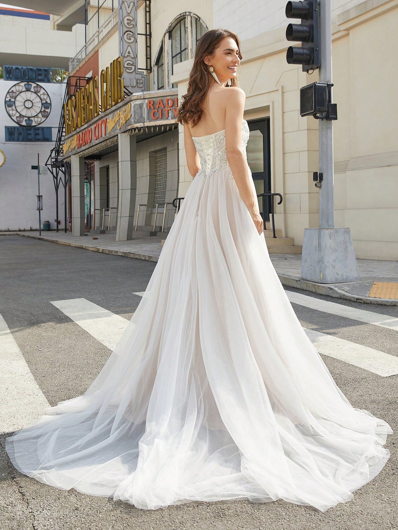 Elegant Strapless Bridal Gown with Sequin Embellishments and High-Slit Tulle Skirt