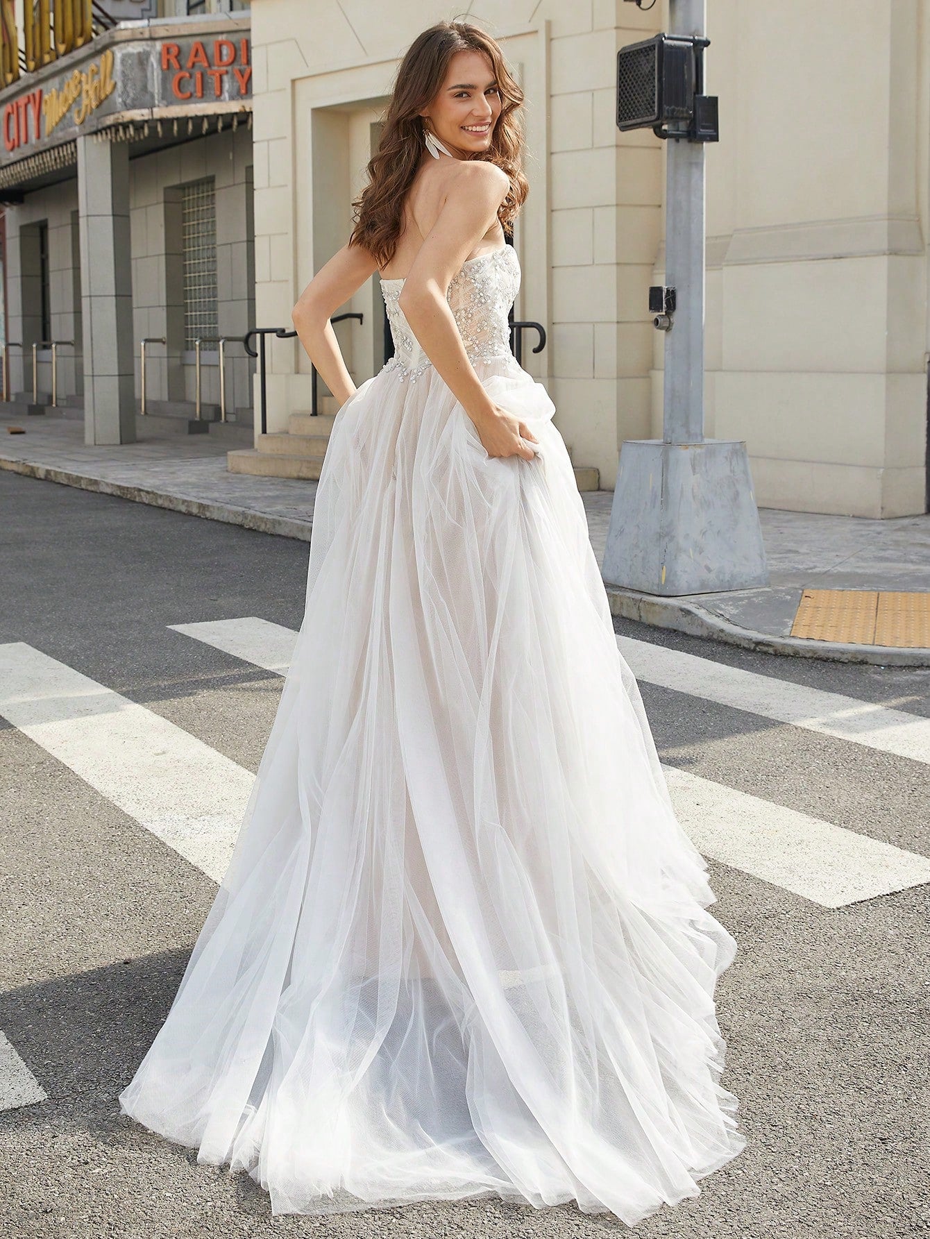 Elegant Strapless Bridal Gown with Sequin Embellishments and High-Slit Tulle Skirt